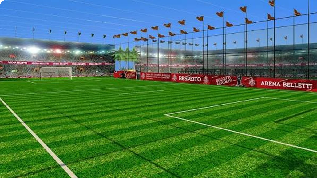Campo de fut7 da Belletti Soccer Academy com bandeirinhas e arquibancada